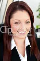 Attractive businesswoman sitting in her office