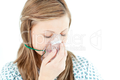 Depressed female patient with a mask