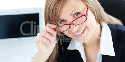 Charismatic businesswoman wearing glasses against white background