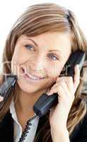 Attractive businesswoman talking on phone holding glasses