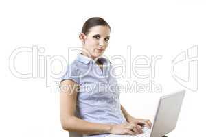 young woman writing email on her laptop