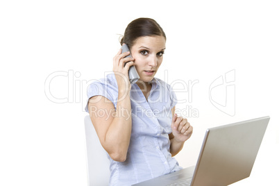 female on the phone in front of her computer