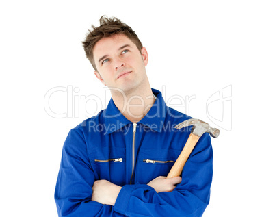 Thoughtful male worker holding a hammer