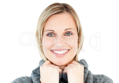 Smiling woman wearing a polo-neck sweater looking at the camera