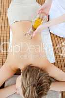 Attractivel woman having a massage with massage oil