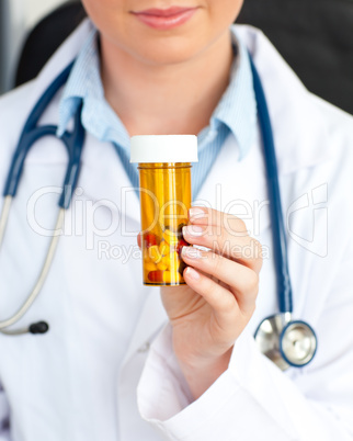 Close-up of a female doctor holding pills