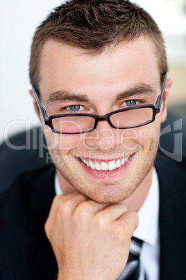 Handsome businessman smiling at the camera