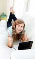 Animated woman with laptop and card on the sofa