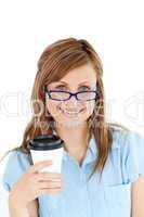 Pretty caucasian businesswoman holding a coffee wearing glasses