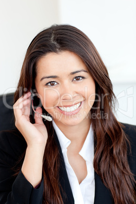 Confident asian businesswoman wearing headphones
