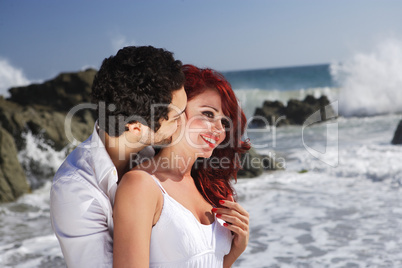 Young Couple at the beach showing affection