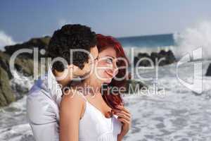 Young Couple at the beach showing affection