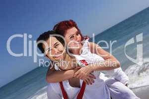 young couple enjoying on the beach
