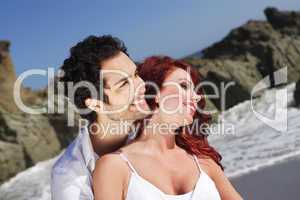 Young Couple at the beach showing affection