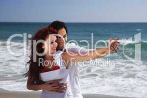 Young Couple at the beach holding hands