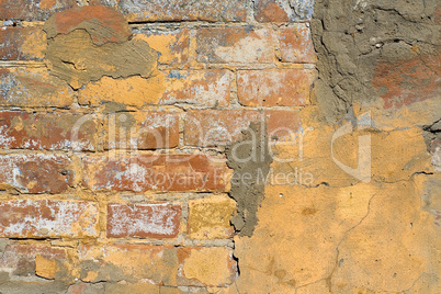 Old plaster on brick wall