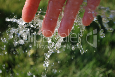 Cold water on green background