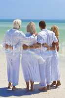 Two Couples Generations of Family Embracing on Tropical Beach