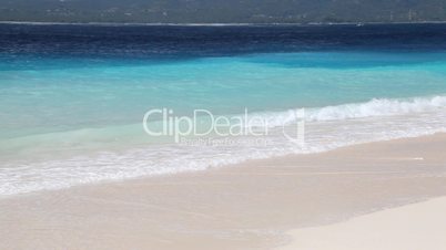 Summertime tropical island white sand beach