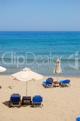 Sunbeds at the beach of luxury hotel, Crete, Greece