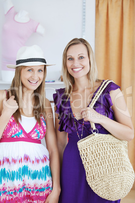 Charming female friends smiling at the camera