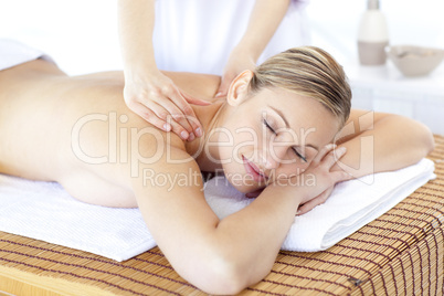 Positive woman having a back massage