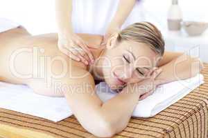 Positive woman having a back massage