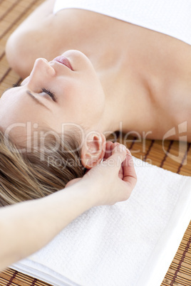 Radiant woman having a head massage