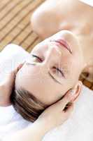 Caucasian relaxed woman having a head massage