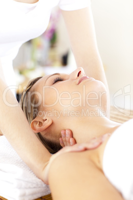 Radiant young woman getting a massage