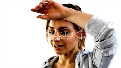 thirsty young female athlete drinking water after a practice