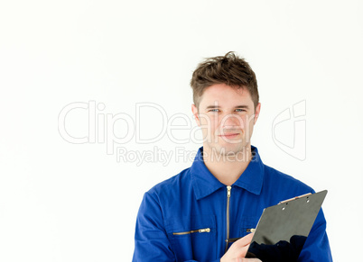 Good-looking male worker holding a document