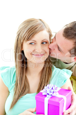 Attractive boyfriend giving a present to his smiling girlfriend