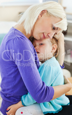 Blond woman taking care of her child