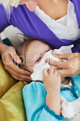 Mother taking care of her ill child
