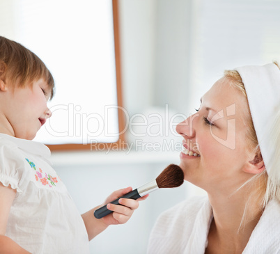 Charming mother taking care of her children