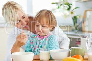 Mother having breakfast with her daughter