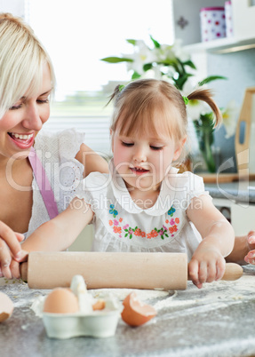 Lucky woman baking cookies with her daughter