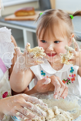 Woman baking cookies with her daughter