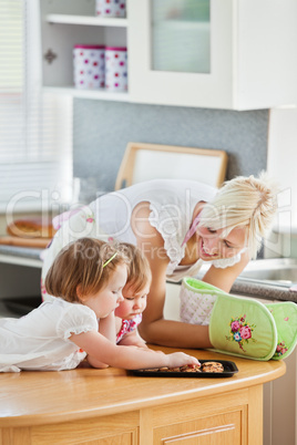 Blond mother having fun with her daughters