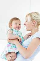 Smiling woman playing with her daughter