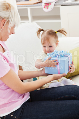 Woman getting a present from her daughter