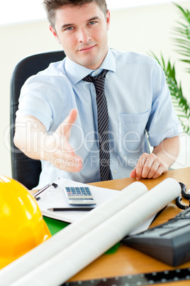 Confident businessman reaching his hand to the camera