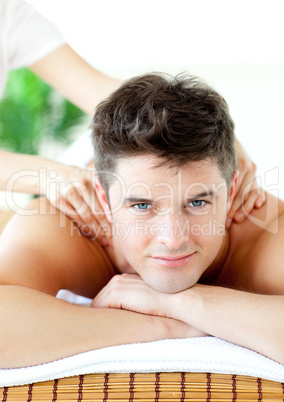 Smiling caucasian man having a back massage