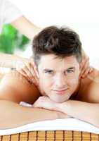 Smiling caucasian man having a back massage