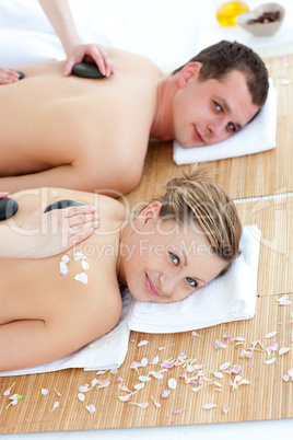 Happy young couple receivinga spa treatment