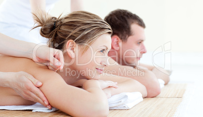 Attractive young couple having an acupunctre therapy