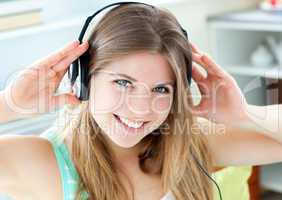 Jolly caucasian woman listen to music with headphones