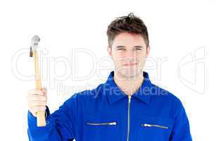 Smiling mechanic holding a hammer looking at the camera