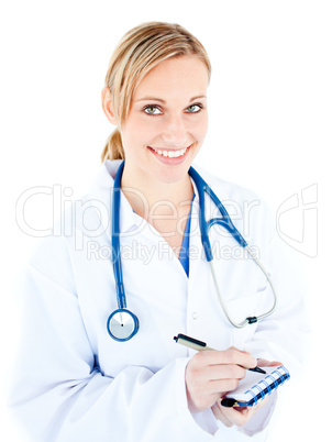 Smiling female doctor taking notes on her notepad